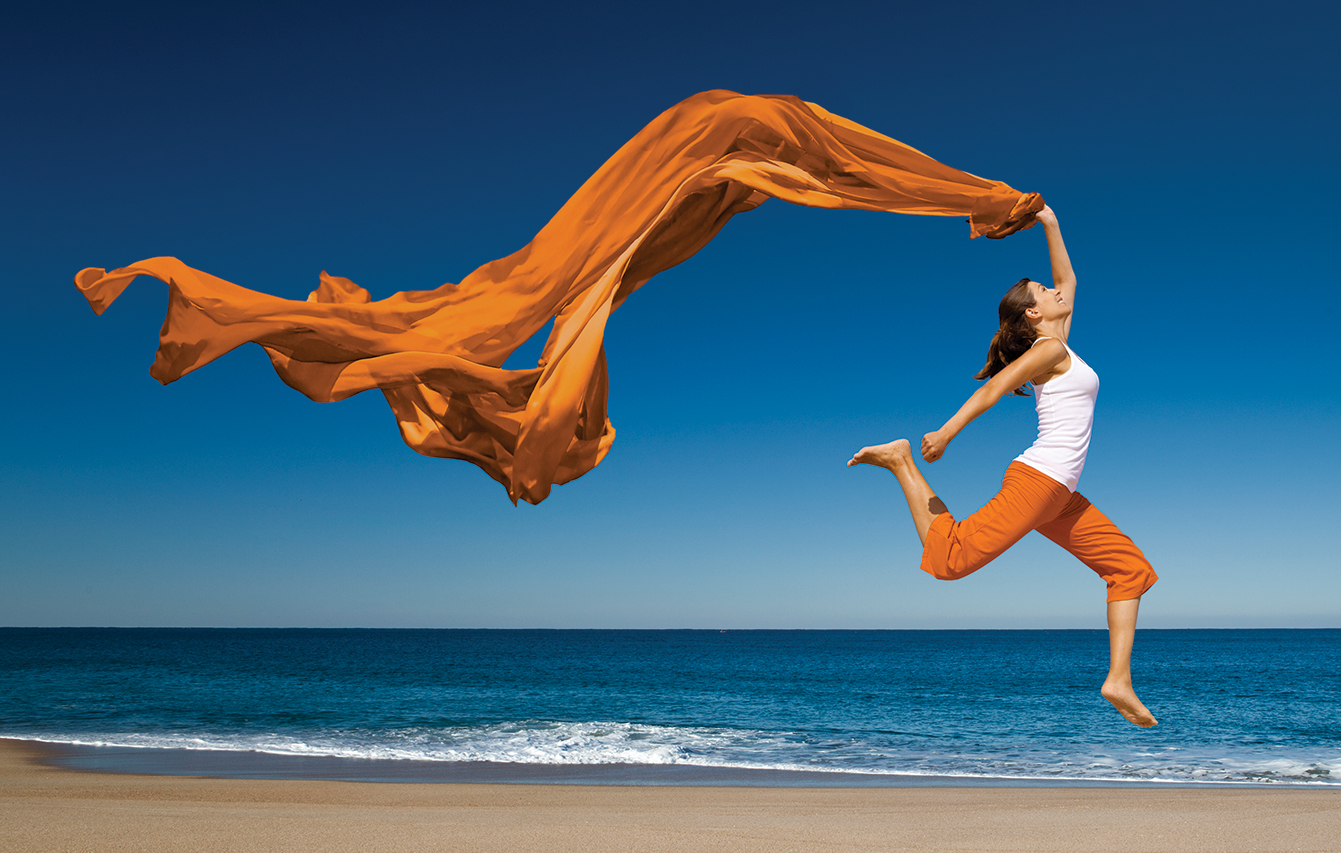 Woman jumping with scarf